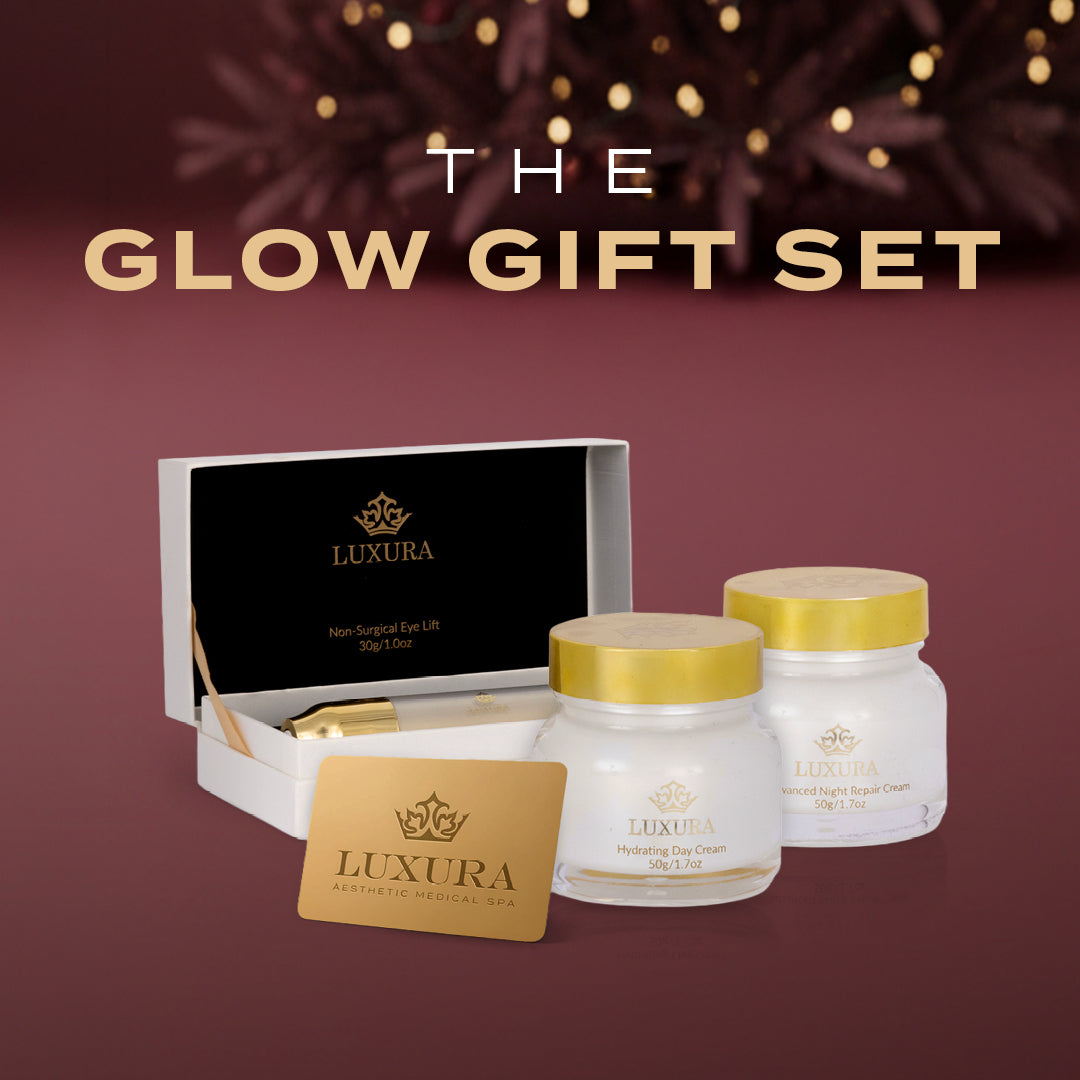 Luxura skincare gift set with jars and a box on a maroon background
